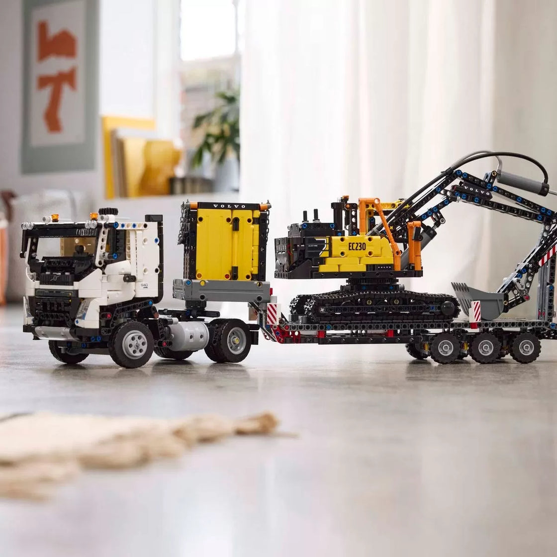 Lego technic camionul fmx și excavatorul electric ec230 de la volvo 42175